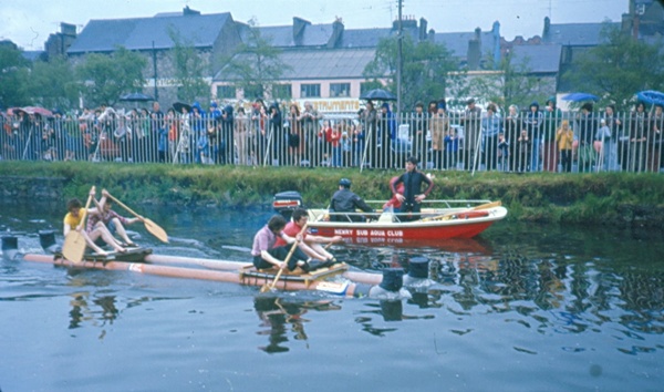 Competitors on a raft made out of pipes, with members of Newry Sub-Aqua Club keeping a close eye on proceedings. Newry and Mourne Museum Collection