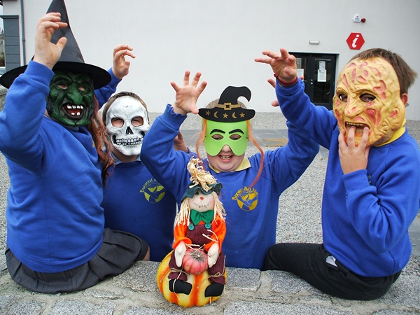 Local school children wearing false faces to celebrate Halloween at the Museum.