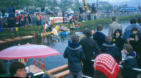 Spectators viewing the bathtub race from Soho Carpark and Merchants’ Quay. The crane in the background was used to place the rafts into the canal. Newry and Mourne Museum Collection