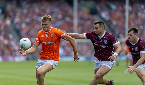 Rian O'Neill working his way past Galway's Cillian McDaid. Photograph: Noel Moan