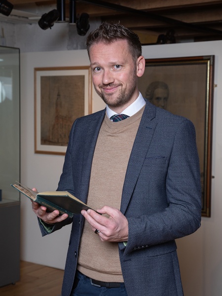 Local businessman Gareth Chambers, viewing his copy of MacCabe’s Directory that has been donated to Newry and Mourne Museum.