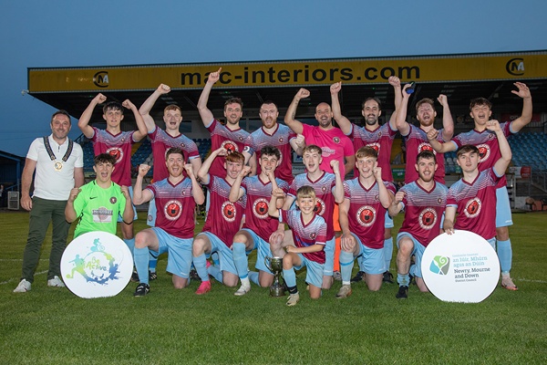 Be Active Cup winners, Ballynahinch Olympic FC celebrate their title with Newry, Mourne and Down District Council Chairperson, Cllr Pete Byrne.