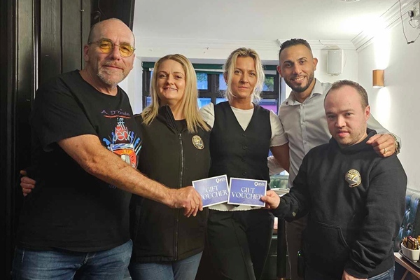 Ian Sands receives a presentation from members of Warrenpoint Chamber of Commerce.