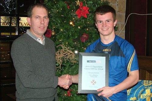  St John Bosco Minor Manager Peadar Gallagher congratulates Aaron Beattie on his Colleges 2012 All Star Award