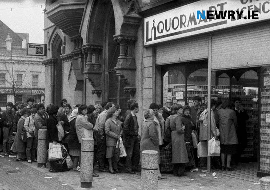 A queue outside a Hill Street off licence in the early 1980's. Photograph: Columba O'Hare/ Newry.ie
