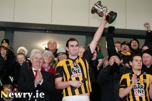 Crossmaglen Rangers Captain David McKenna holds the cup aloft at the Athletic Grounds after beating Kilcoo. Photograph: Columba O'Hare