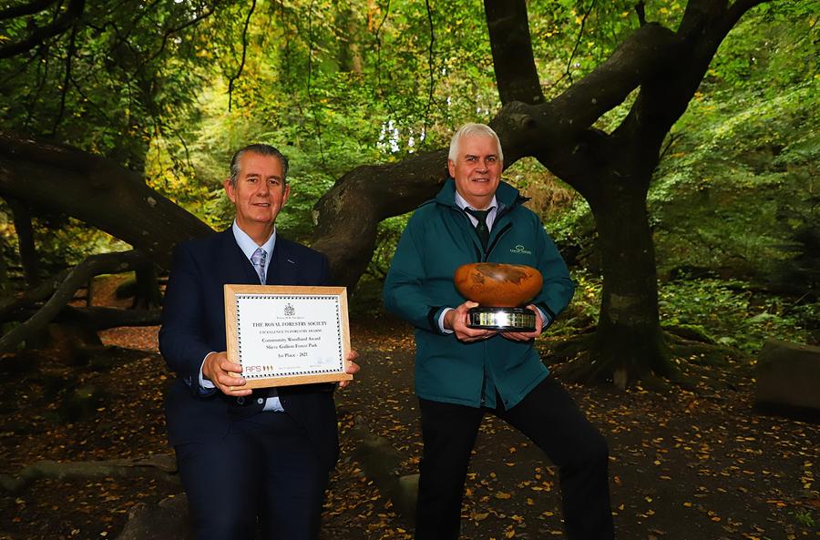 DAERA Minister Edwin Poots MLA and Chief Executive of the Forest Service, John Joe O’Boyle pictured at Slieve Gullion Forest Park with the The Royal Forestry Society’s ‘Community Woodlands Award’.