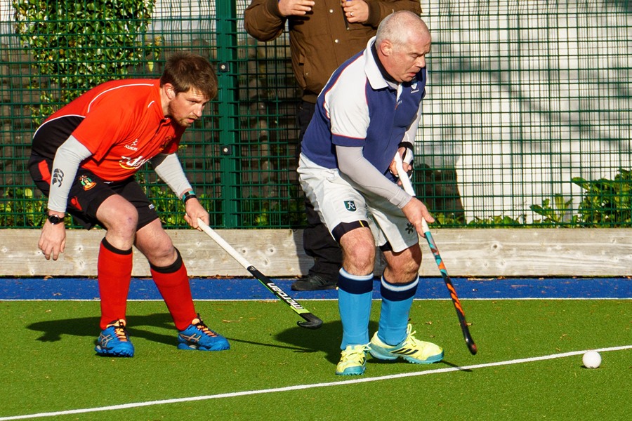 Newry's Gareth McCullough closes in on his Cookstown opponent.