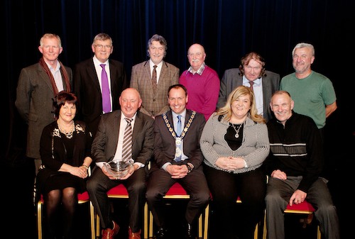 Mayor Mickey Ruane, Brendan Curran, Michael Carr, Mickey Brady MLA, Charlie Casey, Brian Quinn, Davy Hyland and Karen McKevitt MLA are pictured with award reciepient Jim Bagnal, his Wife Josephine and Brother Tony Bagnal.  Photograph: Peter Clarke