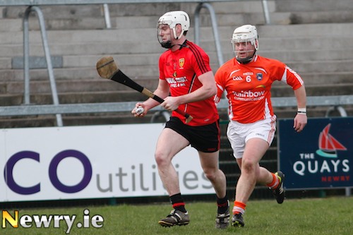 Down's Conor O'Neill is chased by Armagh's Nathan Curry at the Athletic Grounds for the opening game in the Allianz National Hurling League. Photograph: Columba O'Hare
