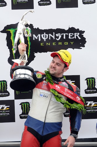 Michael Dunlop celebrates on the podium after winning the Monster Energy Supersport race two at the 2014 Isle of Man TT. Photograph: Pacemaker Michael Dunlop celebrates on the podium after winning the Monster Energy Supersport race two at the 2014 Isle of Man TT. Photograph: Pacemaker