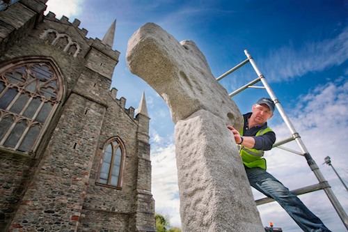 David Murray, stone mason from S McConnell & Sons, Kilkeel, checks out the positioning of the new cross at Down Cathedral David Murray, stone mason from S McConnell & Sons, Kilkeel, checks out the positioning of the new cross at Down Cathedral