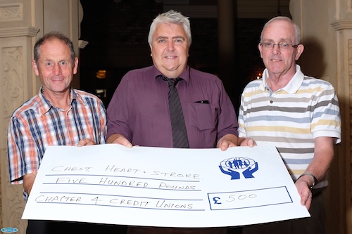 Chapter 4 Credit Union recently organised a quiz at the Canal Court Hotel in aid of Chest Heart and Stroke Association Armagh and Newry. A total of £500 was raised and Brian O'Hare, left from the Credit Union is pictured presenting the cheque to Martin Black, Chest Heart and Stroke Association, Armagh and Newry while looking on is Aidan O'Rourke, right, Quizmaster. Photograph: Columba O'Hare