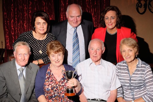 Looking forward to selecting the Best Garden in Newry and Mourne at Newry Show were front: John Fegan, President, Newry Agricultural Society; Ann and John Turley, with the Paddy Hanratty Memorial Cup and Monica McAuley, Judge. Back: Mairead O'Hagan, Secretary, Newry Show; Tommy Collins, Chairman, Newry Show and Cllr Gillian Fitzpatrick, Newry and Mourne District Council. Photograph: Columba O'Hare Looking forward to selecting the Best Garden in Newry and Mourne at Newry Show were front: John Fegan, President, Newry Agricultural Society; Ann and John Turley, with the Paddy Hanratty Memorial Cup and Monica McAuley, Judge. Back: Mairead O'Hagan, Secretary, Newry Show; Tommy Collins, Chairman, Newry Show and Cllr Gillian Fitzpatrick, Newry and Mourne District Council. Photograph: Columba O'Hare