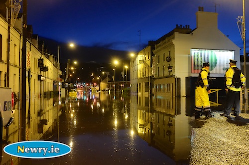 Police on dry land at Floods in Bridge Street in Newry. Photograph: Columba O'Hare Police on dry land at Floods in Bridge Street in Newry. Photograph: Columba O'Hare