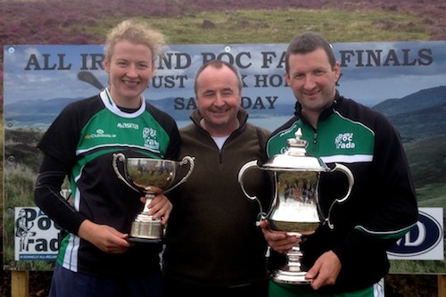 Camloch man Pat Mc Ginn who for many years was also associated with An Poc Fada is pictured celebrating with Brendan and Patricia on the mountain course