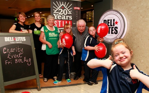 Siobhan Connolly and Michelle McGuinness on behalf of Deli Lites with Martha McGrath Chair of Macmillian Committee, Big O and Special Olympians Rachel, Jack and Leah Fegan (front) pictured in the Food Hall in the Quays, Shopping Centre.