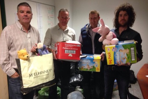 Conor Murphy pictured with his Sinn Féin colleagues with materials awaiting transport to Gaza 