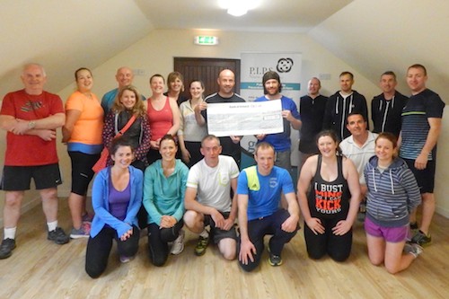 Pictured presenting PIPS volunteer Andrew McKeown with a cheque for £900 is Redmond O'Hanlon's PRO Piers Hoskins