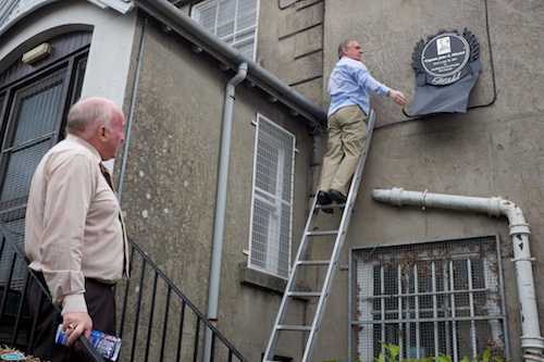 Gerry Coyle, Dromalane and Quayside Close Community Association reaches new heights while unveiling a plaque to John C Mitchel at Dromalane House while James McAreavy, Newry Maritime Association looks on. Photograph: Columba O'Hare Gerry Coyle, Dromalane and Quayside Close Community Association reaches new heights while unveiling a plaque to John C Mitchel at Dromalane House while James McAreavy, Newry Maritime Association looks on. Photograph: Columba O'Hare