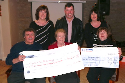 Mrs Sally Hughes from Dromintee presents a Cheque to Mr Paddy O’Hanlon, Treasure of Newry Cancer Research Committee.