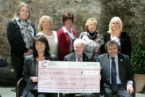 Adele Harris, Local Fundraising Manager for Northern Ireland accepts Cheque for £47,000 from Chairman Gervase McCartan & Treasurer Paddy O'Hanlon while looking on are back from left: Donna McConnell, Cora Trainor, Rosalind McCullough, Ray Dodds & Bernie Ward.