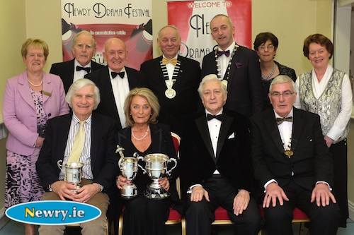 Terry Stewart and Carol Stewart, Holywood Players with their trophies for their play A month in the country at Newry Drama Festival. Also included front is Scott Marshall, Adjudicator and Gerry McNulty, Chairman, Newry Drama Festival. Back: Back: Eileen Mooney, Hon Secretary, NDF; Art Magennis, Vice Chairman; Charlie Smyth, President, NDF; Mac Pollock, Chairman, AUDF; Brendan McGowan, Chairman, ADCI; Christine Farrelly, Hon Treasurer, NDF and Maureen Grant, Press Officer, NDF. Photograph: Columba O'Hare 