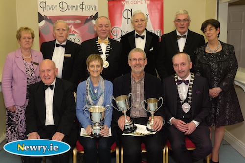 Anne Flannery and Plunkett Ferry from Letterkenny Music and Drama Club with their trophies for their production of The 39 Steps at Newry Drama Festival. Also included front are Charlie Smyth, President, Newry Drama Festival and Brendan McGowan, Chairman, ADCI. Back: Eileen Mooney, Hon Secretary, NDF; Art Magennis, Vice Chairman; Mac Pollock, Chairman, AUDF; Scott Marshall, Adjudicator; Gerry McNulty, Chairman, NDF and Christine Farrelly, Hon Treasurer, NDF. Photograph: Columba O'Hare 