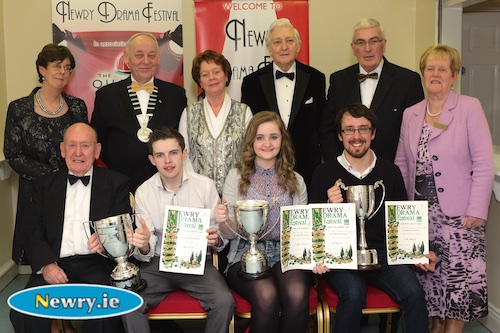 Neil Heaney, Niamh Smyth Hagan and Kilian Foy, Newport Players with their trophies for their production of Metamorphosis at Newry Drama Festival. Also included are, front, Charlie Smyth, President, Newry Drama Festival. Back: Christine Farrelly, Hon Treasurer, NDF; MacPollock, Chairman, AUDF; Maureen Grant, Publicity Officer, NDF; Scott Marshall, Adjudicator; Gerry McNulty, Chairman, NDF and Eileen Mooney, Hon Secretary, NDF. Photograph: Columba O'Hare 