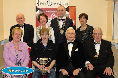 Andrew McCarthy, Ballyduff  Drama Group, Takin over the Asylum with the Gerard Murphy Cup for Best Music and Sound pictured with, back: Charlie Smyth, President, Newry Drama Festival; Maureen Grant, Publicity Officer; Brendan McGowan, Chairman, ADCI and Christine Farrelly, Hon Treasurer, Newry Drama Festival. Front: Eileen Mooney, Hon Secretary; Scott Marshall, Adjudicator and Gerry McNulty, Chairman. Photograph: Columba O'Hare