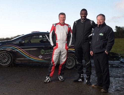 World famous actor Idris Elba (centre) has been trying out a new role as a rally driver on the roads of Monaghan this week before taking part in Easter weekend’s Circuit of Ireland Rally. He was learning the tricks of the trade from experienced World Rally Championship co-driver Michael Orr, from Bangor, and Circuit of Ireland Rally Director Bobby Willis.