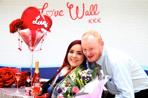 Lisa Dumigan (Warrenpoint) a Sales Assistant with Clarks Shoes and Security Guard Jason Martin (Newry) launch the 'love wall' Lisa Dumigan (Warrenpoint) a Sales Assistant with Clarks Shoes and Security Guard Jason Martin (Newry) launch the 'love wall'