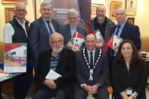 Newry, Mourne and Down District Council Chairperson, Councillor Mickey Ruane with, back row left to right: Stephen Adams (Volunteer Administrator, Contemporary Christianity), Colin Moffett, (Equality Officer), Noel McCune  (Chairman, Contemporary Christianity), Councillor Harry Harvey, Councillor Charlie Casey front row, left to right: Philip Orr, (Historian and Writer), Suzanne Rice, (Crotlieve DEA Co-Ordinator)