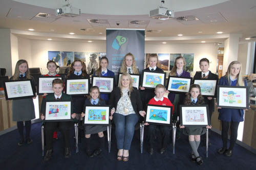 Newry, Mourne and Down District Council Chairperson Cllr Naomi Bailie is pictured with the 13 winning pupils of the Council's Environmental Poster Competition. The winning designs will be made into a calendar, with the overall winner's design to be featured on the front cover. Newry, Mourne and Down District Council Chairperson Cllr Naomi Bailie is pictured with the 13 winning pupils of the Council's Environmental Poster Competition. The winning designs will be made into a calendar, with the overall winner's design to be featured on the front cover.
