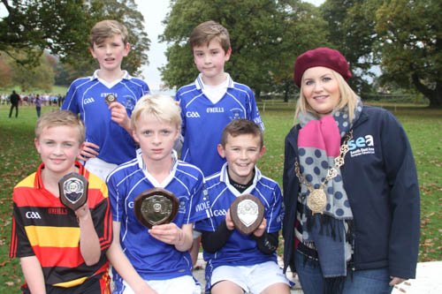 Prizewinners in the 2nd race at Post Primary Schools Cross Country Boys Minnows 1k l-r 3rd Tom The Abbey, 4th Myles St Colman's College, Winner Calum St Colman's College, 5th Ultan St Colman's College and 2nd Leo St Colman's College with Chairperson Newry, Mourne and Down Council Naomi Bailie. Prizewinners in the 2nd race at Post Primary Schools Cross Country Boys Minnows 1k l-r 3rd Tom The Abbey, 4th Myles St Colman's College, Winner Calum St Colman's College, 5th Ultan St Colman's College and 2nd Leo St Colman's College with Chairperson Newry, Mourne and Down Council Naomi Bailie.