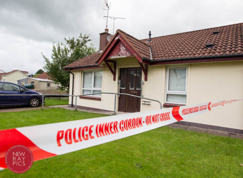 Police seal off the scene in Bessbrook in August. Photograph: NewRayPics