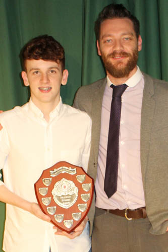 Caomhan Boyle gets his award from Mr Brendan Fearon LLW HOD Caomhan Boyle gets his award from Mr Brendan Fearon LLW HOD