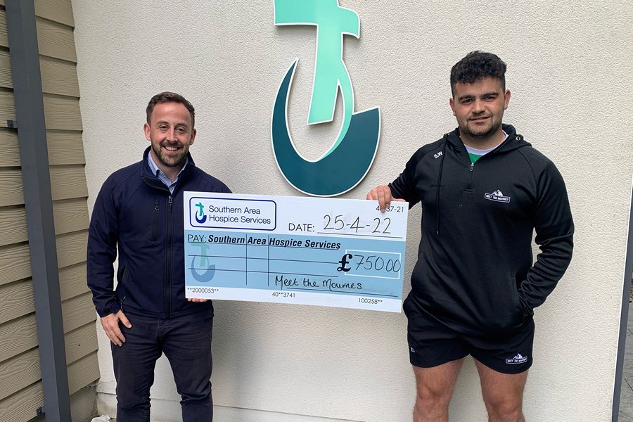 Stephen is pictured presenting his cheque to fundraising officer, James McCaffrey SAHS.’
