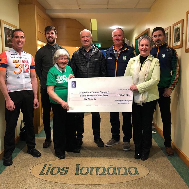 The O’Hagan family and members of Lissummon GFC presenting the £8066 cheque to Martha McGrath from MacMillan Cancer.