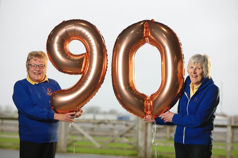 Kathleen Verner, WI Federation Vice Chairman and Heather Adamson, WI Balmoral Show Sub Committee Chairman, celebrate the WI’s 90th Anniversary and their return to Balmoral Show 2022.