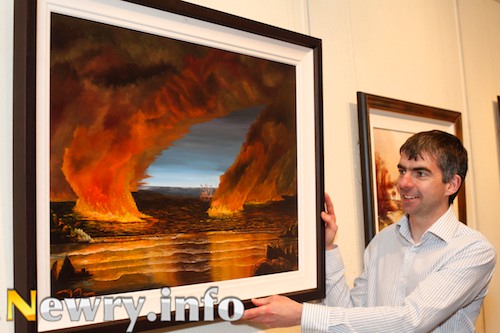 Neill Haughey with his Oils Up (Oil Sharks) painting at the launch of Newry Art Society's Spring Exhibition. Picture: Columba O'Hare