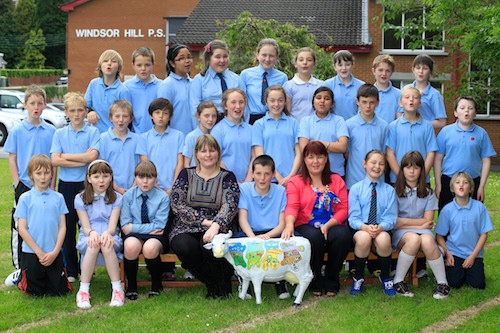 Windsor Hill PS pupil Lewis Moore, centre displays his winning entry along with Teacher Olivia Kerrigan and Aislinn Lavery of Ulster Bank and his P7 class mates. Photo: Columba O'Hare 