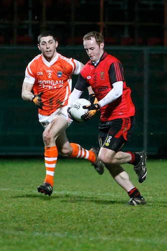 Down's Benny Coulter and Armagh's Vincent Martin at last years game. Photo: Columba O'Hare