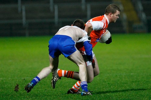 Armagh's Gareth Swift gets shirty with Monaghan's Carl O'Connell at the Power NI Dr McKenna Clash in the Morgan Athletic Grounds. Picture: Columba O'Hare