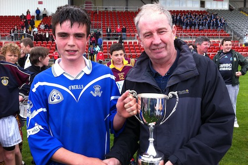 Pearse Óg Mc Crickard is presented with the cup