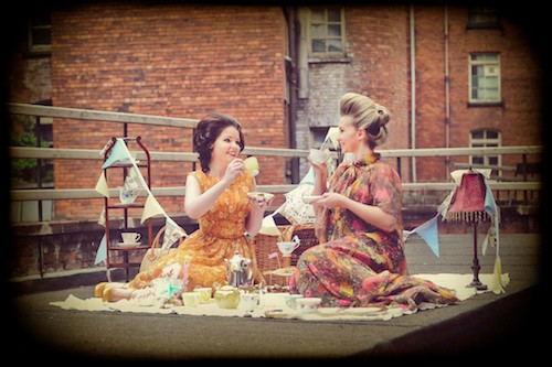 Vintage Picnic – Orlaith wears Dress: The Vintage Bride, Shoes: Vintage LA and Laura wears Dress: Norma Jean Vintage. Vintage china – Decadence, and bunting, cakes and cake stand – Rosie Lee Vintage Teas