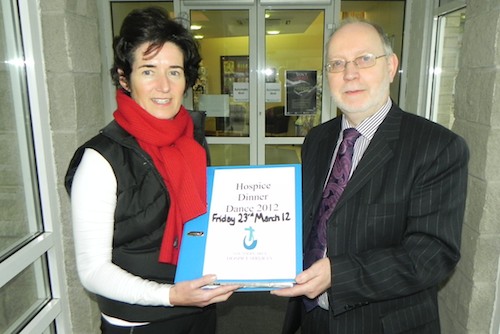  Liam Goss hands over to incoming Chairperson of the Hospice Dinner Dance Committee, Dr Petrina Flood. 