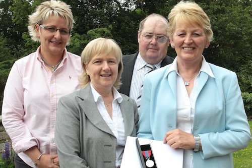 Rachel McBride, right was accompanied to the presentation at Stormont House (l to r)  by her daughter Faith, colleague Philomena Lennon and partner Jim Graham.