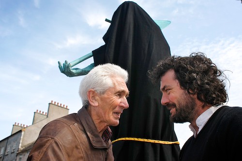 It's behind you! - Joe Rooney, left, Chairman of Newry's Canal Street Area Heritage Partnership chats to Sculptor Barry Linnane at the unveiling of Barrys Creation The Newry Navvy on Sugar Island Bridge in Newry. Picture: Columba O'Hare