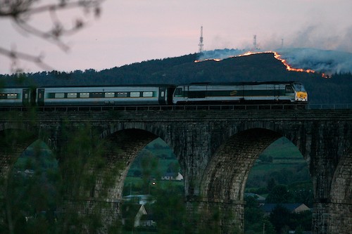 Camlough Mountain burning as the Enterprise goes over the 18 Arches at Bessbrook. Picture: Columba O'Hare